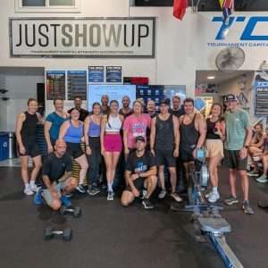 TCSC members high-fiving after class, smiling and celebrating their workout together.